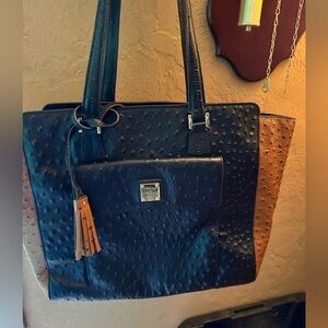 Dooney and Bourke East West Shopper, new price was $468. Comes with a dust bag.